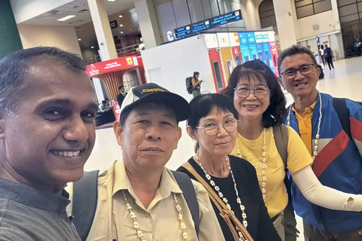 Nishan with guests at an airport arrival